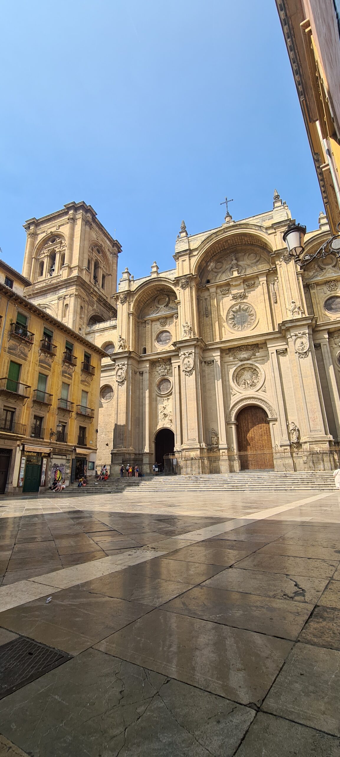 The main area in front of Granada Cathedral is the Plaza de las Pasiegas