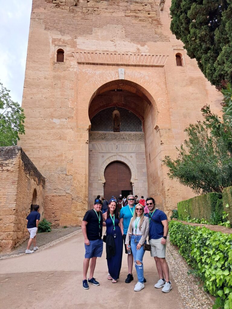 Motril to Granada. Clients standing in front of the Justice Gate at the Alhambra in Granada.